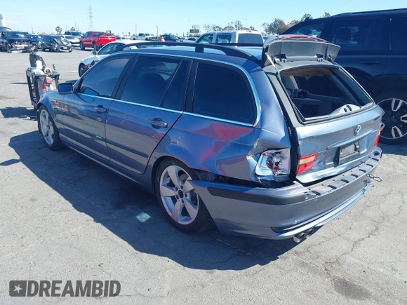 2003 BMW 3 Series 325i with VIN WBAEN33443PC11690, listed as a IAAI auction lot 41939082 with 159,123 mi miles. Bid and sale history available at carsss.com. Image 3.