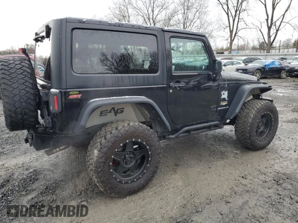 2014 Jeep Wrangler Sahara with VIN 1C4AJWBG0EL306703, listed as a Copart auction lot 51450215 with 115,932 mi miles and Salvage Title. Bid and sale history available at DreamBid. Image 3.