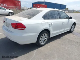 2014 Volkswagen Passat Wolfsburg Ed with VIN 1VWAT7A32EC099677, listed as a IAAI auction lot 41872416 with 182,392 mi miles. Bid and sale history available at carsss.com. Image 4.