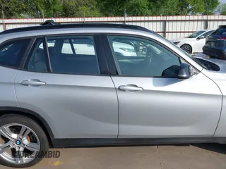 2014 BMW X1 sDrive28i z VIN WBAVM1C51EVW52544, wystawiony jako IAAI lot #41901275 z przebiegiem 117 832 mil mil oraz . Historia ofert i sprzedaży dostępna na DreamBid. Obrazek 14.