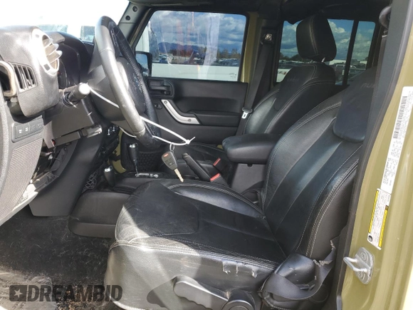2013 Jeep Wrangler Unlimited Rubicon 10th Anniversary with VIN 1C4HJWFG4DL549065, listed as a Copart auction lot 75899594 with 127,960 mi miles and Salvage title. Bid and sale history available at DreamBid. Image 7.
