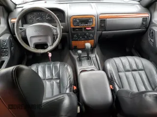 1999 Jeep Grand Cherokee Limited with VIN 1J4GW68SXXC582343, listed as a Copart auction lot 51067695 with 157,456 mi miles and Clean Title. Bid and sale history available at carsss.com. Image 8.