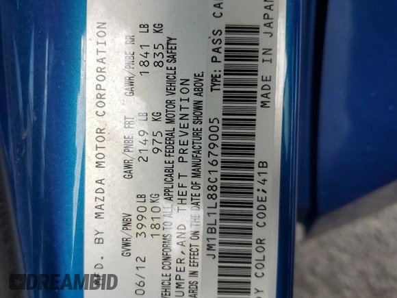 2012 Mazda 3 i Touring with VIN JM1BL1L88C1679005, listed as a Copart auction lot 64215215 with 133,091 mi miles and Salvage title. Bid and sale history available at DreamBid. Image 13.