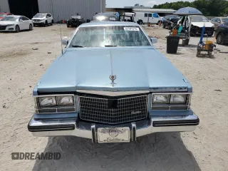 1985 Cadillac Seville z VIN 1G6KS6985FE825187, wystawiony jako Copart lot #54197375 z przebiegiem 2706 mil mil oraz Tytuł czysty. Historia ofert i sprzedaży dostępna na DreamBid. Obrazek 5.