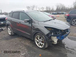 2015 Ford Escape Titanium with VIN 1FMCU9J94FUB49236, listed as a IAAI auction lot 42117378 with 112,267 mi miles. Bid and sale history available at carsss.com. Image 1.