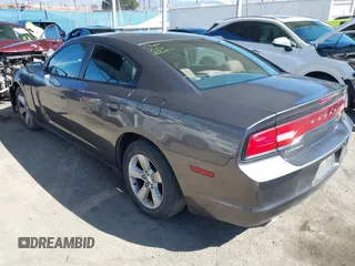 2013 Dodge Charger SE with VIN 2C3CDXBGXDH688230, listed as a IAAI auction lot 41634325 with 133,519 mi miles. Bid and sale history available at carsss.com. Image 3.