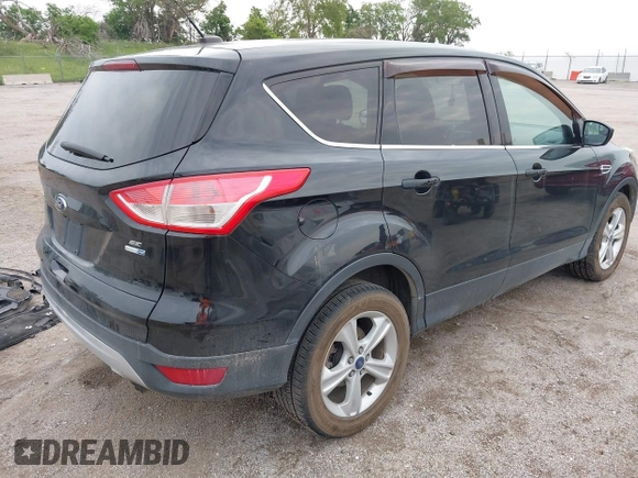 2014 Ford Escape SE with VIN 1FMCU9G96EUD61299, listed as a IAAI auction lot 42411069 with 147,957 mi miles and . Bid and sale history available at DreamBid. Image 4.