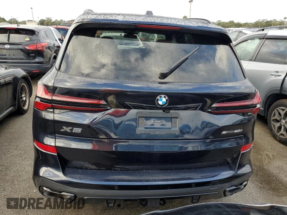 2025 BMW X5 sDrive40i with VIN 5UX13EU05S9W56291, listed as a Copart auction lot 73857164 with 0 mi miles and Salvage Title. Bid and sale history available at carsss.com. Image 6.