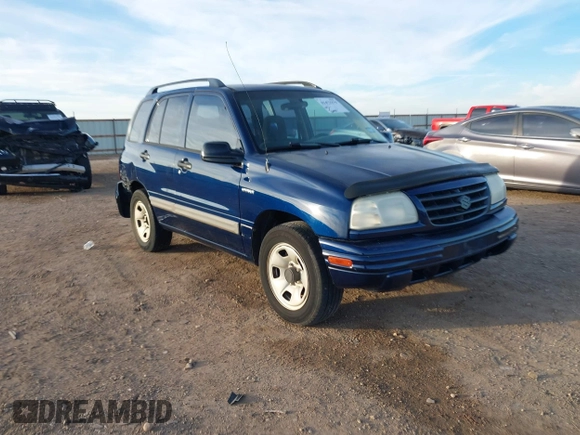 2003 Suzuki Vitara z VIN 2S3TE52V436101091, wystawiony jako IAAI lot #41472279 z przebiegiem 163 429 mil mil oraz . Historia ofert i sprzedaży dostępna na DreamBid. Obrazek 1.
