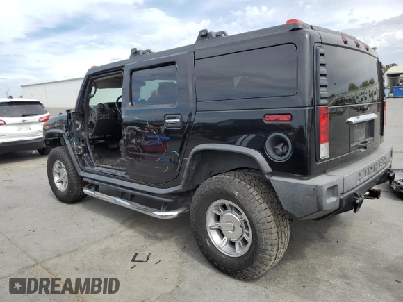 2005 Hummer H2 SUV with VIN 5GRGN23UX5H115383, listed as a Copart auction lot 71682984 with 157,405 mi miles and Salvage Title. Bid and sale history available at carsss.com. Image 2.