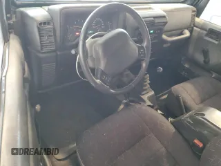 2002 Jeep Wrangler Sport with VIN 1J4FA49S82P713459, listed as a Copart auction lot 52745955 with 173,297 mi miles and Salvage Title. Bid and sale history available at carsss.com. Image 8.