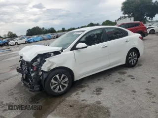 2023 Kia Rio S with VIN 3KPA24AD3PE573452, listed as a Copart auction lot 68249544 with 12,001 mi miles and Non Repairable. Bid and sale history available at DreamBid. Image 1.