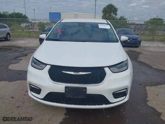 2023 Chrysler Pacifica Hybrid Touring L with VIN 2C4RC1L74PR541551, listed as a IAAI auction lot 42028927 with 57,772 mi miles. Bid and sale history available at carsss.com. Image 12.