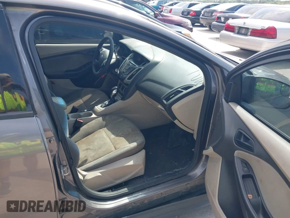 2012 Ford Focus SE z VIN 1FAHP3F24CL294391, wystawiony jako IAAI lot #42545359 z przebiegiem 190 904 mil mil oraz . Historia ofert i sprzedaży dostępna na DreamBid. Obrazek 5.