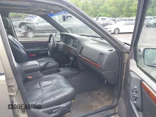 1998 Jeep Grand Cherokee Limited z VIN 1J4GZ78Y5WC261391, wystawiony jako IAAI lot #42275913 z przebiegiem 180 552 mil mil oraz . Historia ofert i sprzedaży dostępna na DreamBid. Obrazek 5.