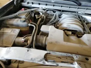 2018 Chevrolet Silverado 1500 LT z VIN 3GCUKREC9JG213996, wystawiony jako Copart lot #70379115 z przebiegiem 104 786 mil mil oraz Szkoda całkowita • Salvage title. Historia ofert i sprzedaży dostępna na DreamBid. Obrazek 13.