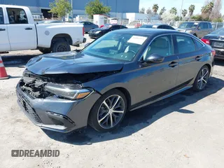 2023 Honda Civic Sedan Touring with VIN 2HGFE1F91PH310656, listed as a IAAI auction lot 41884334 with 17,691 mi miles. Bid and sale history available at carsss.com. Image 18.