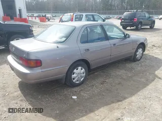 1996 Toyota Camry DX with VIN 4T1BG12K8TU762073, listed as a IAAI auction lot 41606136 with 254,939 mi miles. Bid and sale history available at carsss.com. Image 4.