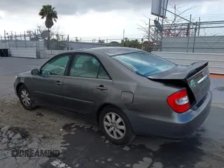 2004 Toyota Camry LE with VIN 4T1BF32K84U588764, listed as a IAAI auction lot 42126345 with 144,642 mi miles. Bid and sale history available at carsss.com. Image 3.
