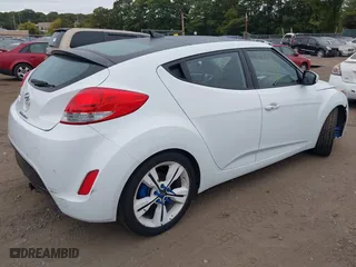 2016 Hyundai Veloster with VIN KMHTC6ADXGU273034, listed as a IAAI auction lot 40420771 with 206,694 mi miles. Bid and sale history available at carsss.com. Image 4.
