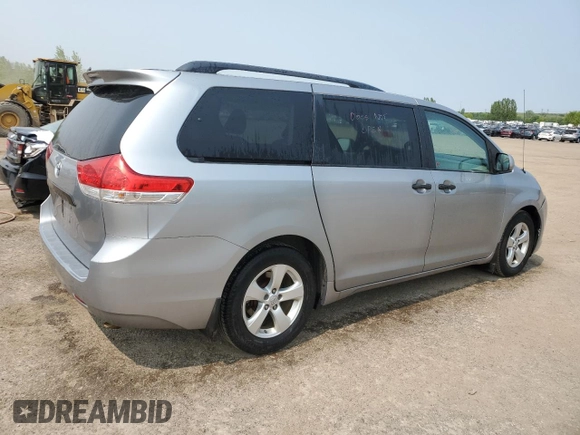 2014 Toyota Sienna L with VIN 5TDZK3DC8ES442973, listed as a Copart auction lot 59660055 with 310,496 mi miles and Salvage title. Bid and sale history available at DreamBid. Image 3.