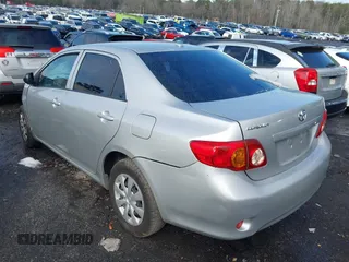 2009 Toyota Corolla with VIN JTDBL40E899083155, listed as a IAAI auction lot 41056942 with 294,132 mi miles. Bid and sale history available at carsss.com. Image 3.