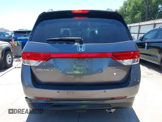 2015 Honda Odyssey Touring Elite z VIN 5FNRL5H99FB017517, wystawiony jako IAAI lot #42246066 z przebiegiem 104 878 mil mil oraz . Historia ofert i sprzedaży dostępna na DreamBid. Obrazek 16.