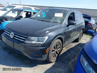 2021 Volkswagen Tiguan SE with VIN 3VV3B7AX0MM129887, listed as a IAAI auction lot 40565638 with 84,790 mi miles. Bid and sale history available at carsss.com. Image 2.