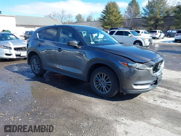 2017 Mazda CX-5 Touring with VIN JM3KFBCL3H0214881, listed as a IAAI auction lot 41694560 with 64,609 mi miles. Bid and sale history available at carsss.com. Image 1.