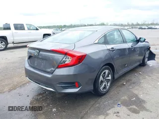 2019 Honda Civic LX with VIN 19XFC2F68KE007409, listed as a IAAI auction lot 41887406 with 57,147 mi miles and . Bid and sale history available at DreamBid. Image 4.