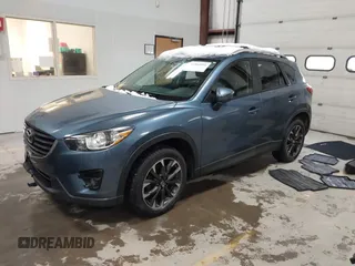 2016 Mazda CX-5 Grand Touring z VIN JM3KE4DY9G0714468, wystawiony jako IAAI lot #41860956 z przebiegiem 114 481 mil mil oraz . Historia ofert i sprzedaży dostępna na DreamBid. Obrazek 17.