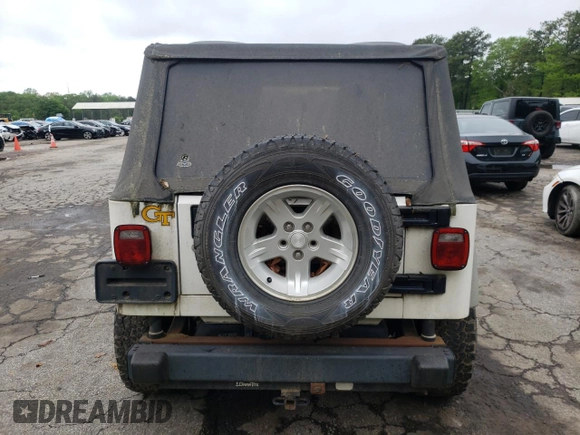 2005 Jeep Wrangler Sport z VIN 1J4FA49S55P334844, wystawiony jako Copart lot #52026835 z przebiegiem 209 216 mil mil oraz Czysty tytuł • Clean title. Historia ofert i sprzedaży dostępna na DreamBid. Obrazek 6.