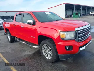 2015 GMC Canyon 4WD SLT z VIN 1GTG6CE30F1100250, wystawiony jako IAAI lot #42217729 z przebiegiem 99 148 mil mil oraz . Historia ofert i sprzedaży dostępna na DreamBid. Obrazek 1.
