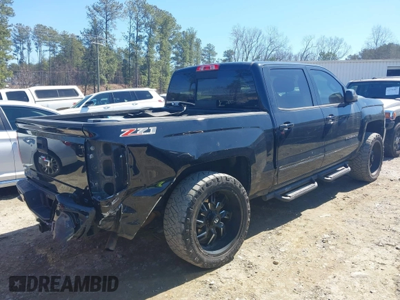 2017 Chevrolet Silverado 1500 LT with VIN 3GCUKREC1HG358752, listed as a IAAI auction lot 41775110 with 150,528 mi miles and . Bid and sale history available at DreamBid. Image 4.