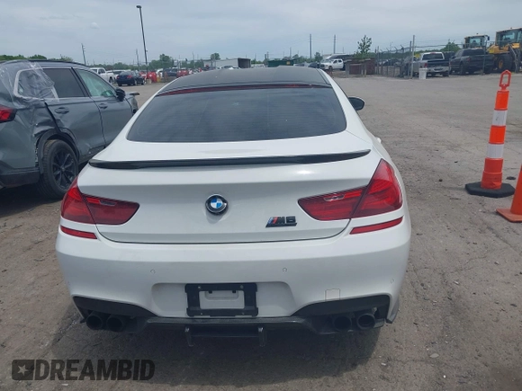 2015 BMW M6 z VIN WBS6C9C50FD467538, wystawiony jako IAAI lot #42366043 z przebiegiem 66 379 mil mil oraz . Historia ofert i sprzedaży dostępna na DreamBid. Obrazek 16.