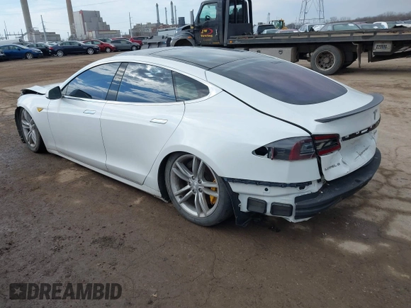 2012 Tesla Model S Performance with VIN 5YJSA1DP4CFP02346, listed as a IAAI auction lot 41642201 with Not Provided miles. Bid and sale history available at carsss.com. Image 3.