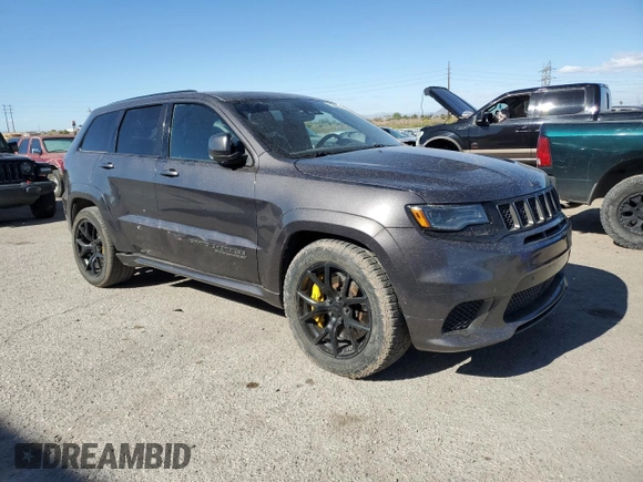 2018 Jeep Grand Cherokee Trackhawk with VIN 1C4RJFN96JC377074, listed as a Copart auction lot 53305975 with 27,625 mi miles and Salvage title. Bid and sale history available at DreamBid. Image 4.