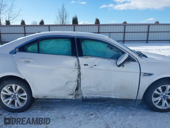 2011 Ford Taurus SEL z VIN 1FAHP2EW2BG143071, wystawiony jako IAAI lot #41538097 z przebiegiem 126 668 mil mil oraz . Historia ofert i sprzedaży dostępna na DreamBid. Obrazek 13.