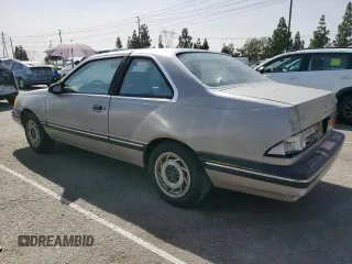 1989 Ford Tempo z VIN 1FAPP31X0KK113919, wystawiony jako Copart lot #76599314 z przebiegiem 65 823 mil mil oraz Tytuł czysty. Historia ofert i sprzedaży dostępna na DreamBid. Obrazek 2.