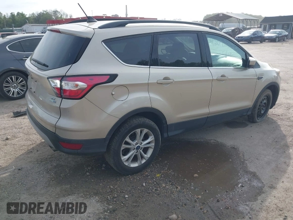 2018 Ford Escape SE z VIN 1FMCU9GD1JUB02119, wystawiony jako IAAI lot #42092393 z przebiegiem 69 309 mil mil oraz . Historia ofert i sprzedaży dostępna na DreamBid. Obrazek 4.