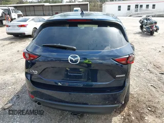 2021 Mazda CX-5 Grand Touring with VIN JM3KFBDM8M0484383, listed as a IAAI auction lot 41800786 with 58,617 mi miles. Bid and sale history available at carsss.com. Image 16.