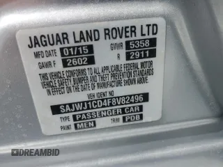 2015 Jaguar XJ with VIN SAJWJ1CD4F8V82496, listed as a Copart auction lot 71013474 with 52,744 mi miles and Salvage title. Bid and sale history available at DreamBid. Image 13.