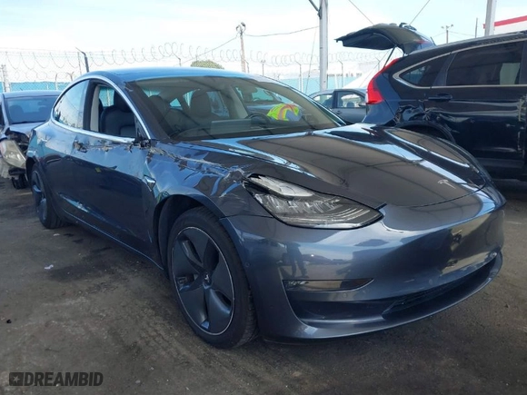 2018 Tesla Model 3 Long Range Battery with VIN 5YJ3E1EA9JF039615, listed as a IAAI auction lot 41756040 with 88,802 mi miles. Bid and sale history available at carsss.com. Image 1.