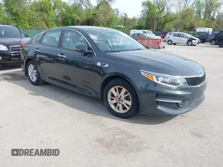 2016 Kia Optima LX with VIN KNAGT4L37G5073752, listed as a IAAI auction lot 42132621 with 136,818 mi miles. Bid and sale history available at carsss.com. Image 1.