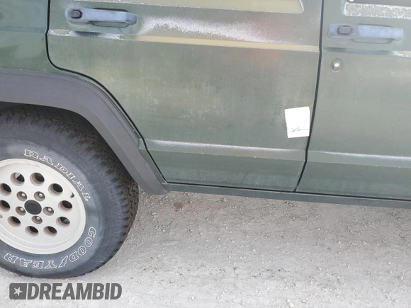 1996 Jeep Cherokee SE z VIN 1J4FJ28S9TL211073, wystawiony jako Copart lot #78052574 z przebiegiem 174 967 mil mil oraz Nie do naprawy • Non repairable. Historia ofert i sprzedaży dostępna na DreamBid. Obrazek 13.
