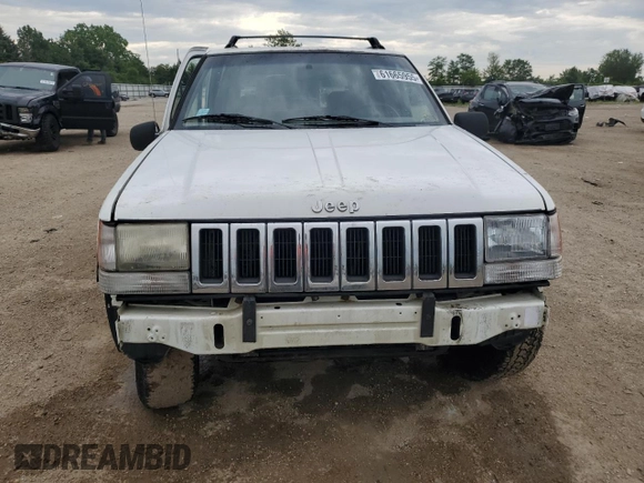 1995 Jeep Grand Cherokee Laredo z VIN 1J4GZ58S2SC578183, wystawiony jako Copart lot #61665955 z przebiegiem 341 135 mil mil oraz Szkoda całkowita • Salvage title. Historia ofert i sprzedaży dostępna na DreamBid. Obrazek 5.