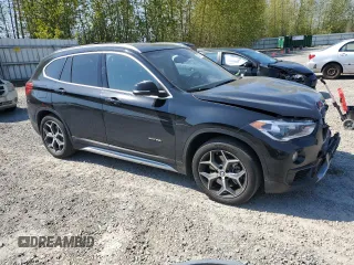 2017 BMW X1 xDrive28i with VIN WBXHT3C32H5F82141, listed as a Copart auction lot 53311785 with 52,867 mi miles and Salvage Title. Bid and sale history available at carsss.com. Image 4.