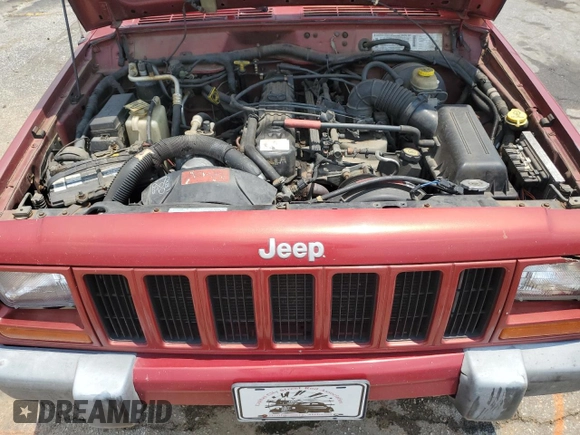1999 Jeep Cherokee Sport with VIN 1J4FT68SXXL669549, listed as a Copart auction lot 62367015 with 194,446 mi miles and Salvage title. Bid and sale history available at DreamBid. Image 12.