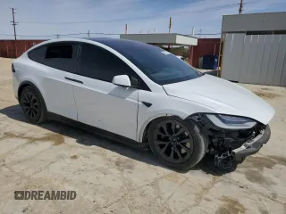 2022 Tesla Model X with VIN 7SAXCBE52NF362994, listed as a Copart auction lot 49850475 with 55,506 mi miles and Salvage Title. Bid and sale history available at DreamBid. Image 4.