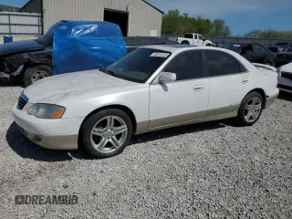 2002 Mazda Millenia S z VIN JM1TA222921719734, wystawiony jako Copart lot #54915125 z przebiegiem 160 254 mil mil oraz Szkoda całkowita • Salvage title. Historia ofert i sprzedaży dostępna na DreamBid. Obrazek 1.